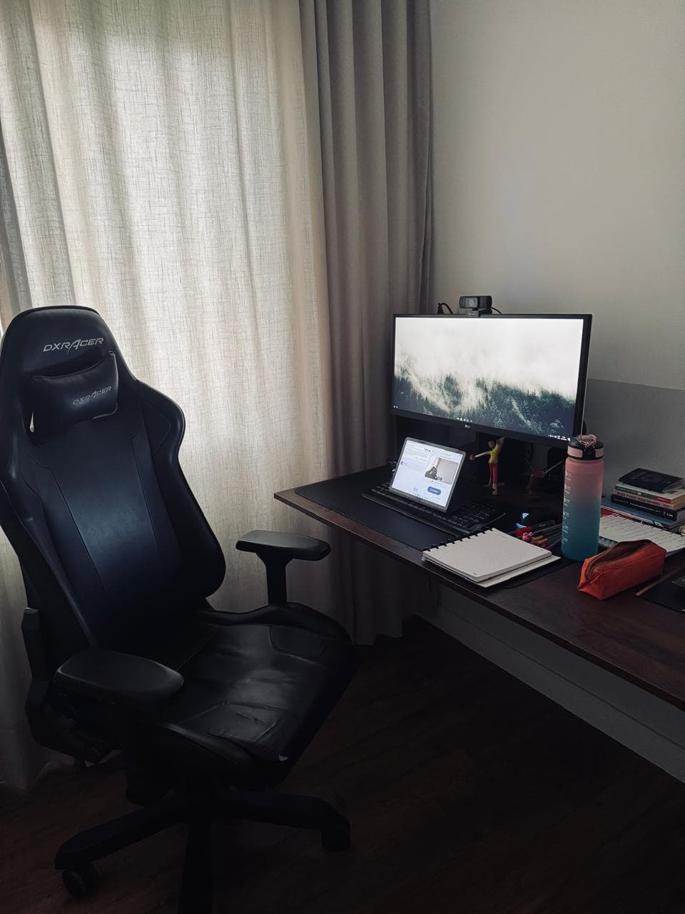 Sanctuary Office - Minimalist cozy therapy room with soft beige armchairs, pampas grass in a vase, and warm sunlight filtering through linen curtains